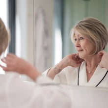 Load image into Gallery viewer, reflection of mature woman wearing the "Bella" wig by La Vida Wigs