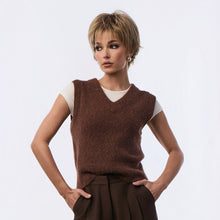 Load image into Gallery viewer, Woman wearing the "Codi" wig by Rene of Paris and a brown sleeveless sweater over a white shirt.