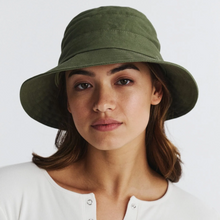 Load image into Gallery viewer, Woman wearing a green bucket hat against a white background